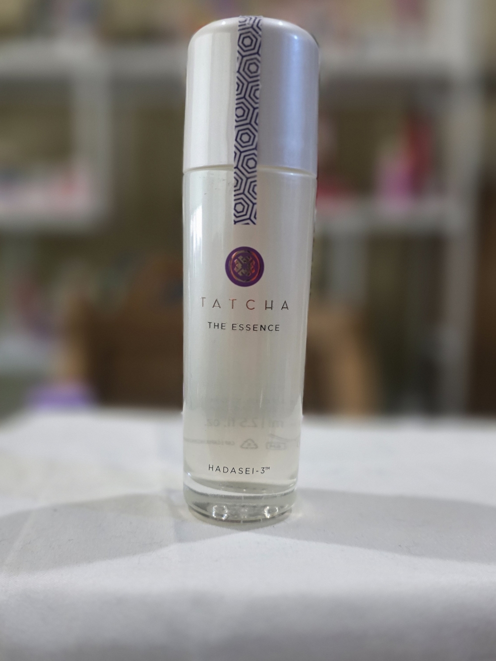 Tatcha The Essence Bottle - White & Purple Accents